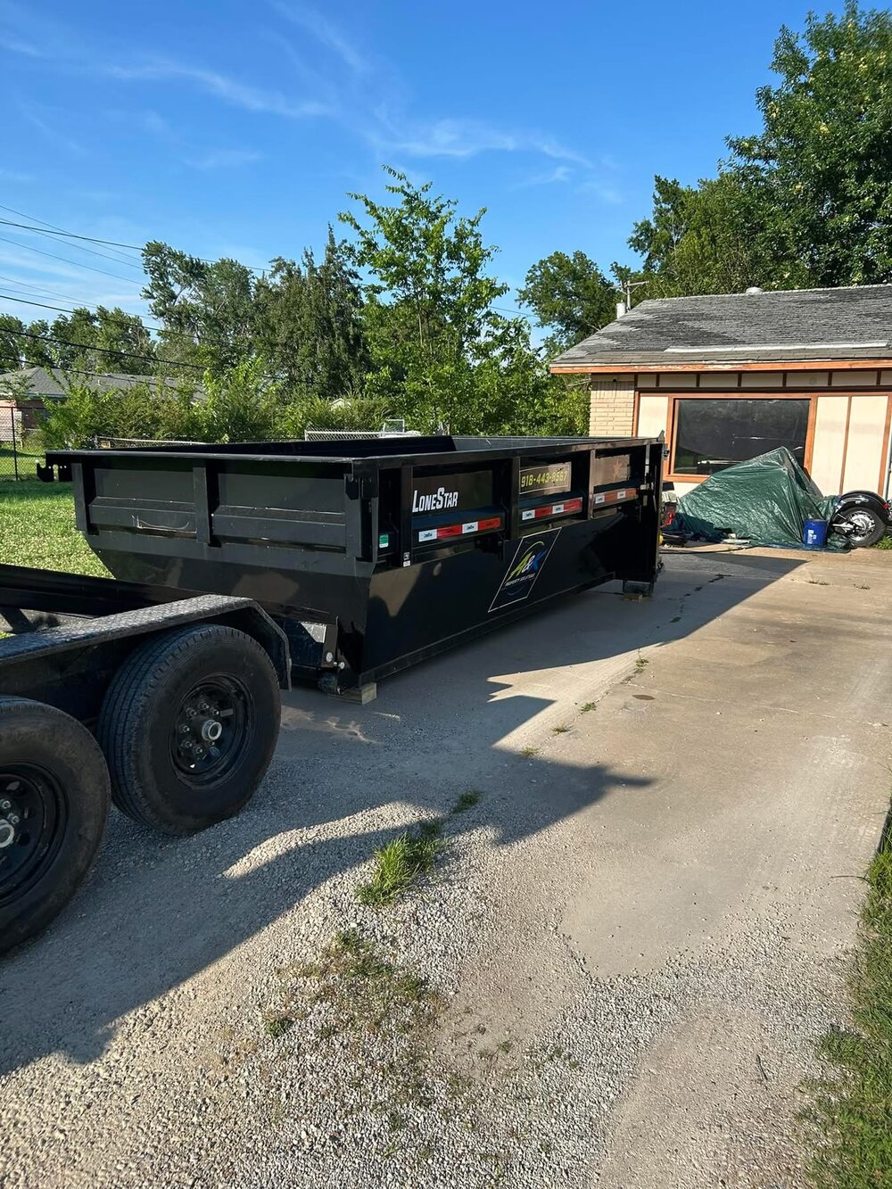 A&K Property Solutions heavy-duty dump trailer ready for a job